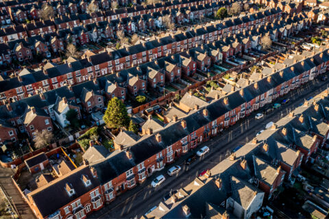 Aerial view of the rooftops of back to back terraced houses in the North of England